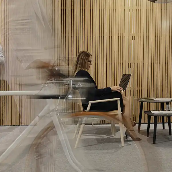 Woman sitting in a chair and using a laptop